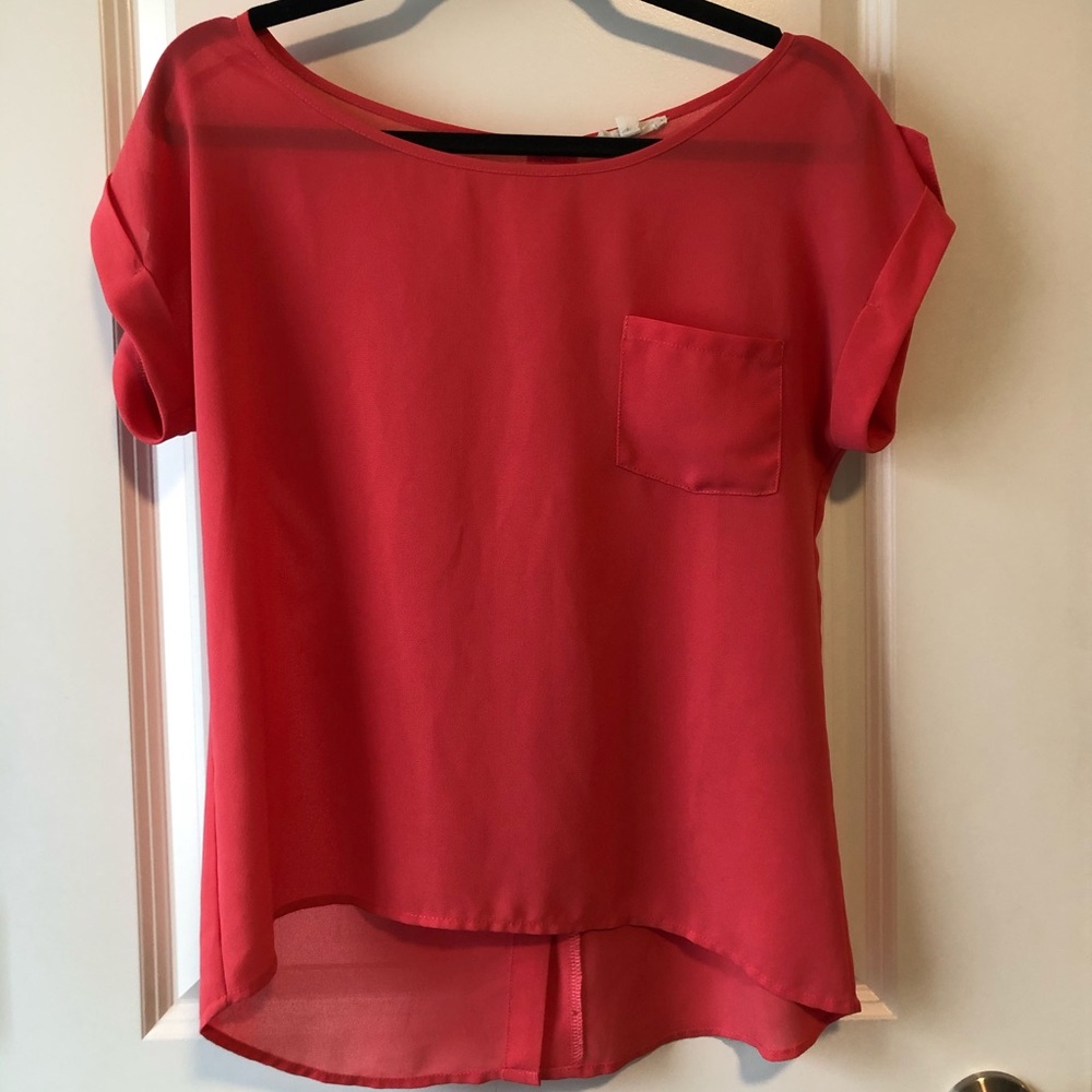 pink blouse with buttons down the back